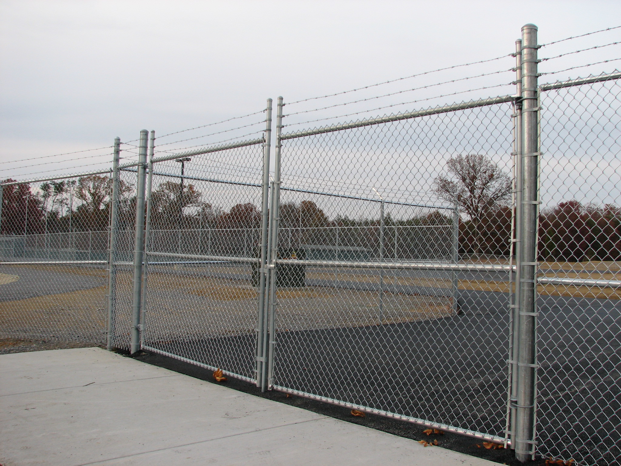 chain link fence with barbed wire